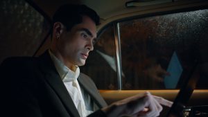 Business man working tablet in private car closeup. Manager tapping tab screen